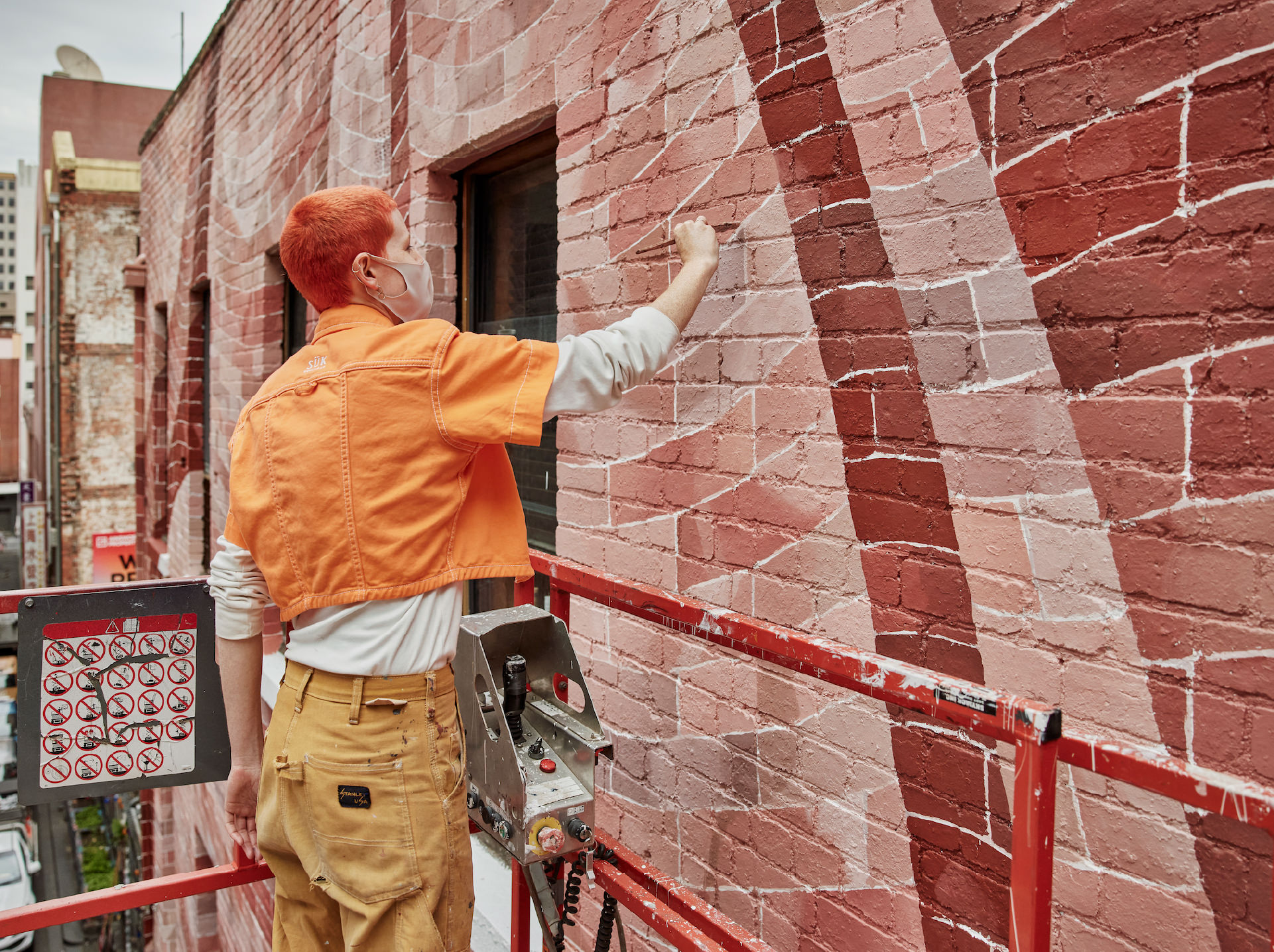 George Goodnow working on the mural 'Bending Brickwork'