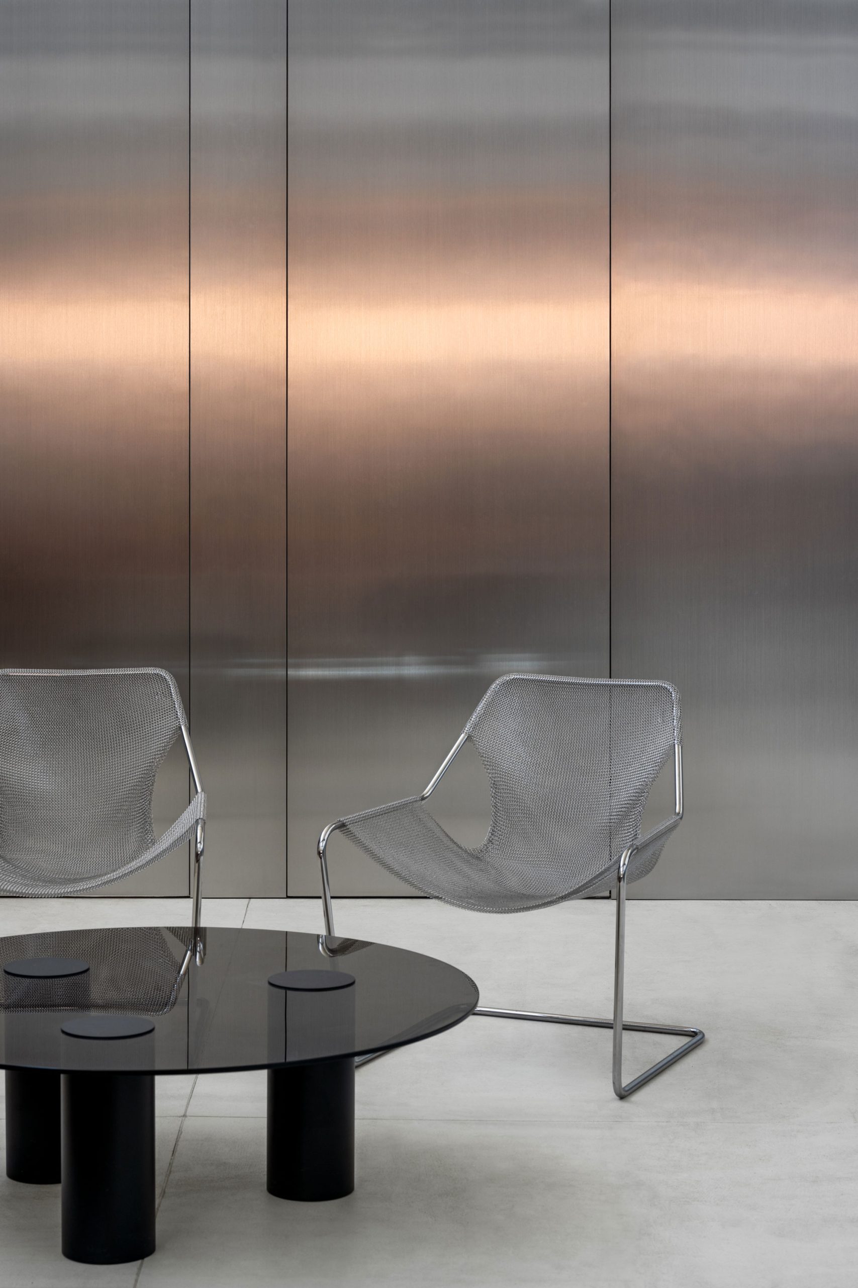 Paulistano Mesh chairs set against a backdrop of steel laminate joinery in the Cera Stribley Melbourne Studio