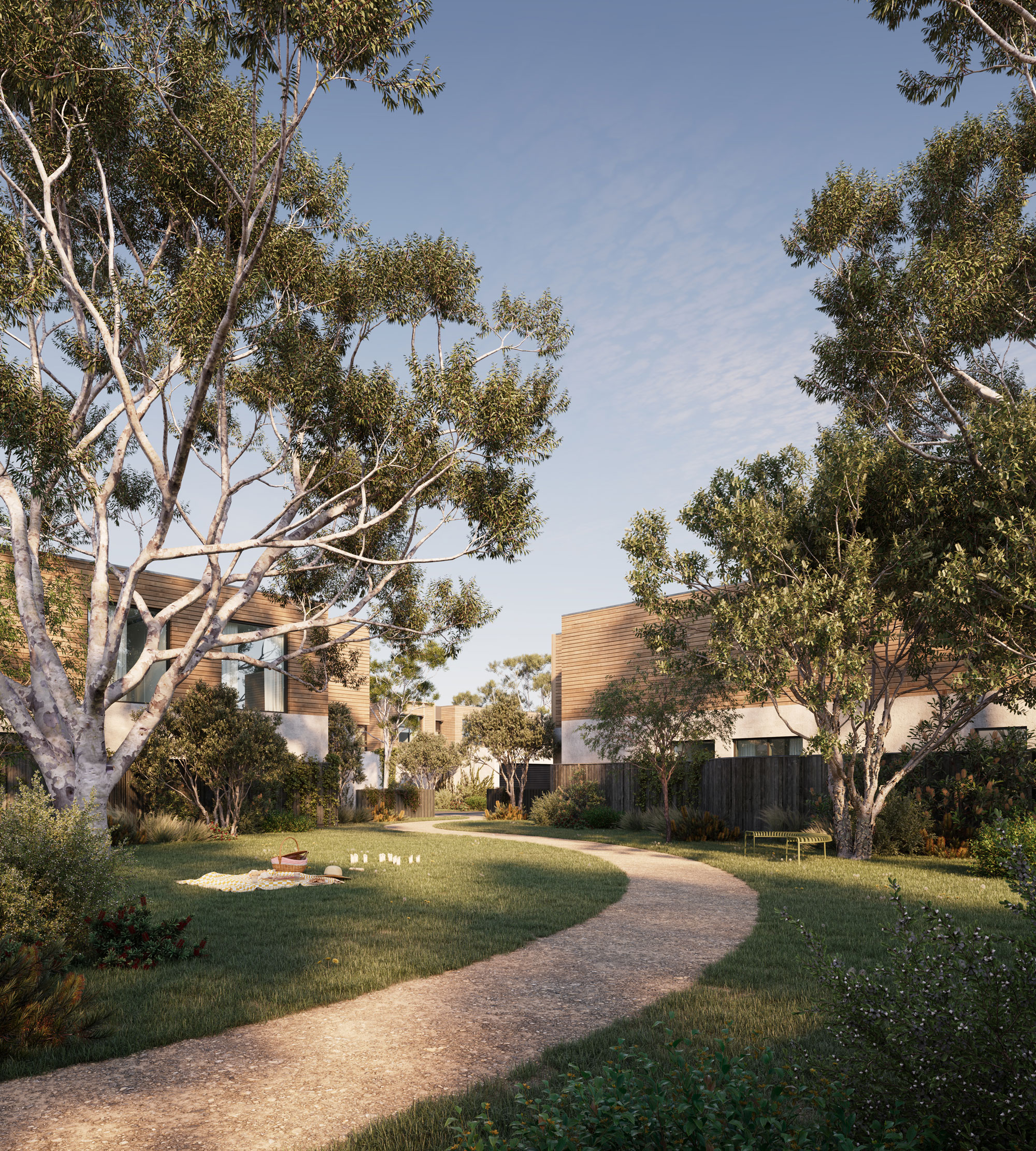 Lush landscaping surrounds timber clad townhouses.