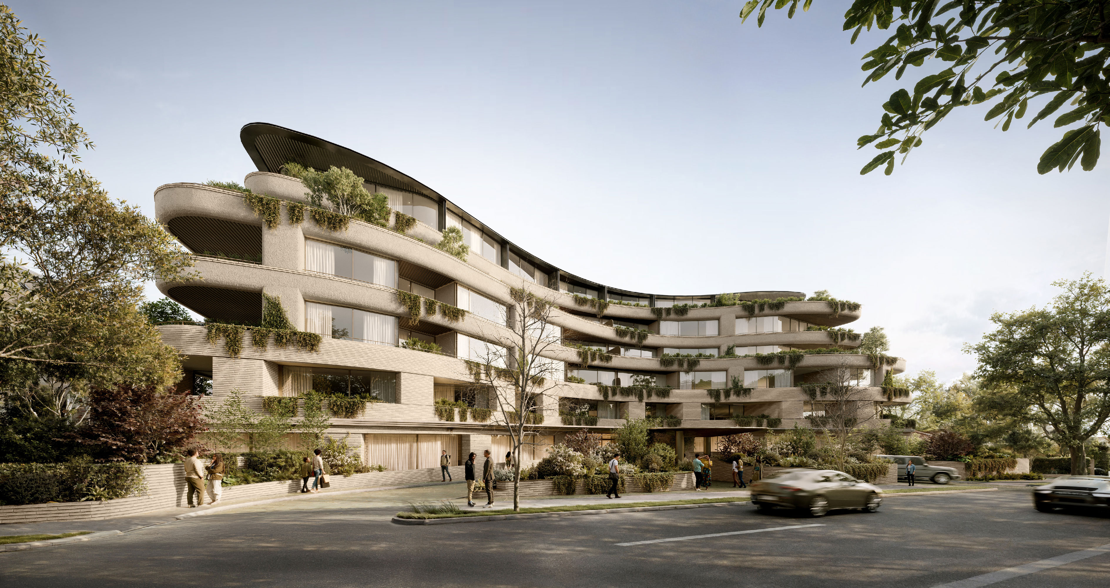 A contemporary multi-residential building at 138 Barkers Road, Kew, featuring a curved facade with layered balconies, integrated planting and a textured brick podium addressing the main road.