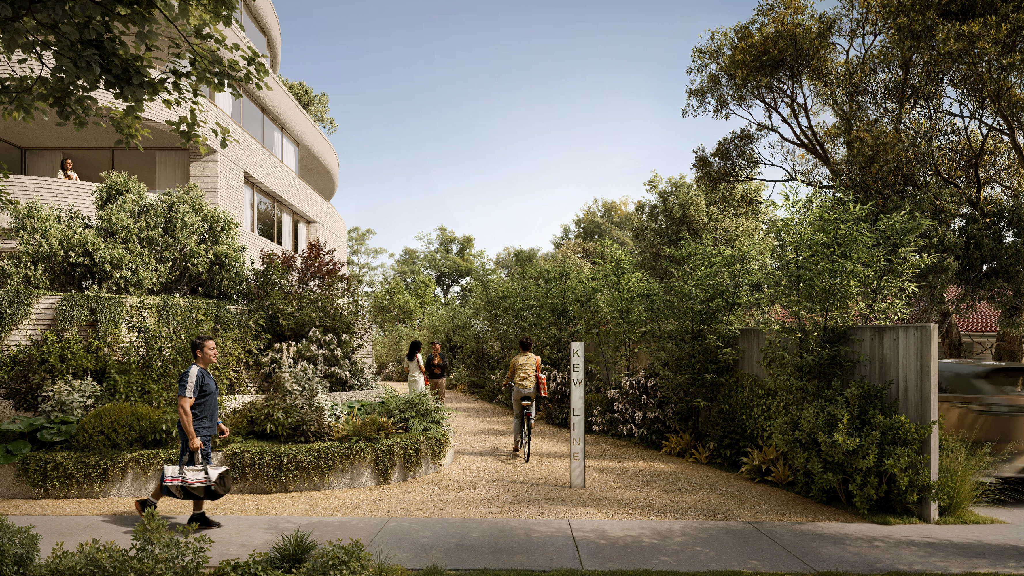 Landscaped gravel pathway with cyclists and pedestrians passing a vertical 'Kew Line' sign, surrounded by dense native planting, with the curved building façade visible to the left